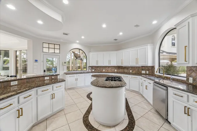 a spacious bedroom with a bed and large windows