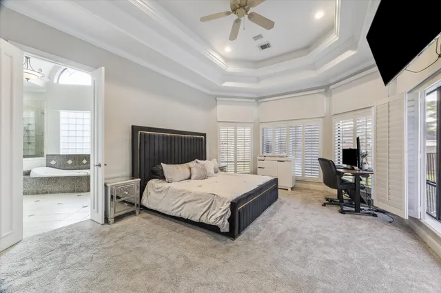 a bed room with a bed and a television