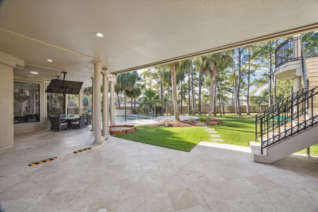 a view of a swimming pool with a patio