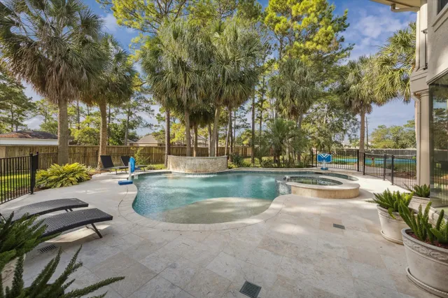 a view of swimming pool with a yard