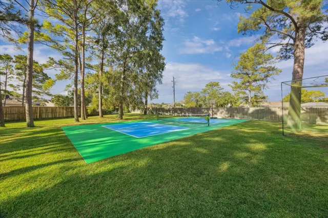 a view of a park with large trees