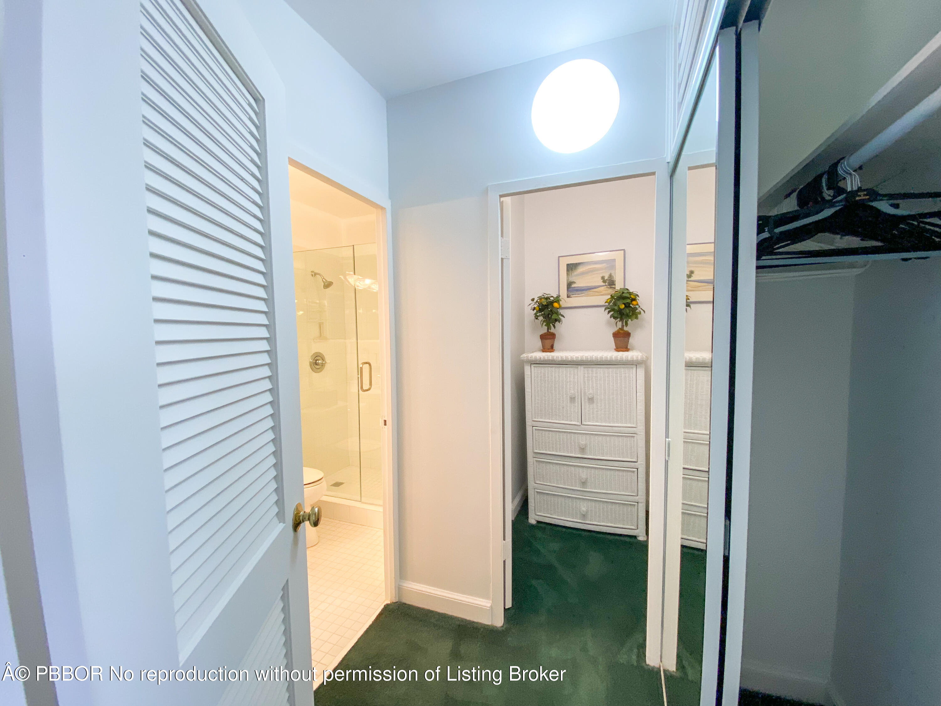 44 Cocoanut Row, Unit 610A Palm Beach, FL 33480 - Photo 7 of 13 a view of a hallway with wooden floor windows and a bathroom