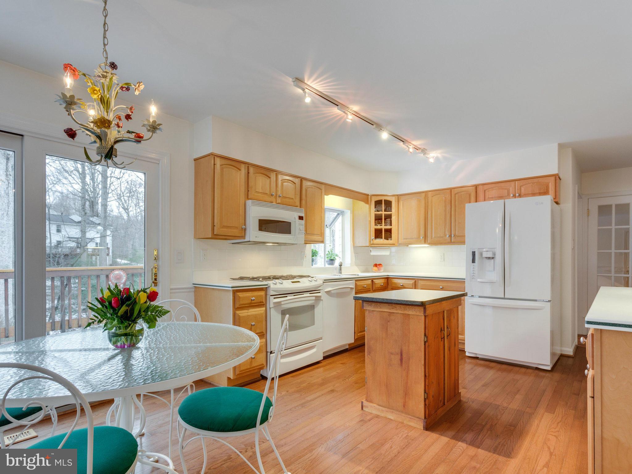 2808 Bree Hill Road Oakton, VA 22124 - Photo 9 of 29 Sun-drenched Kitchen w Gleaming White Appliances