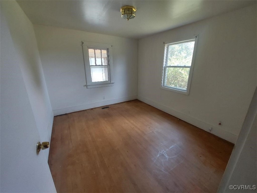 4870 Water View Road Water View, VA 23180 - Photo 9 of 14 Empty room featuring light wood-style floors and b