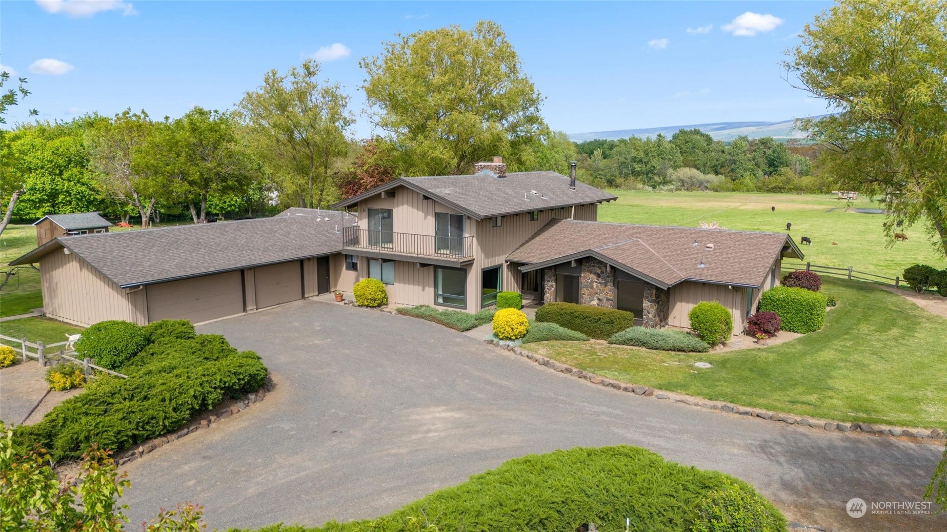 85017 Tum-A-Lum Road Milton Freewater, OR 97862 - Photo 2 of 40 a view of a house with a yard and potted plants
