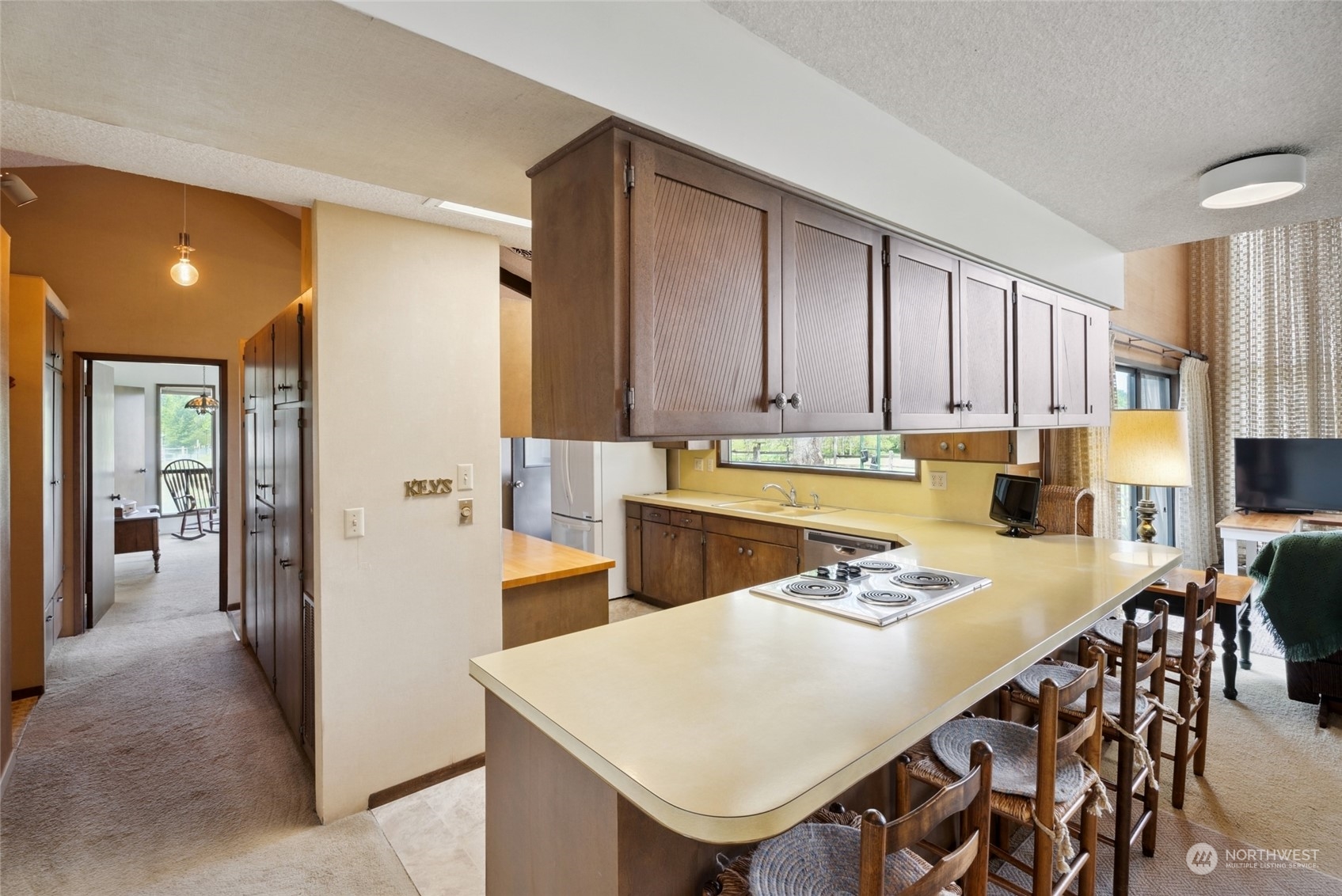 85017 Tum-A-Lum Road Milton Freewater, OR 97862 - Photo 7 of 40 a kitchen with stainless steel appliances kitchen island granite countertop a table chairs and a refrigerator