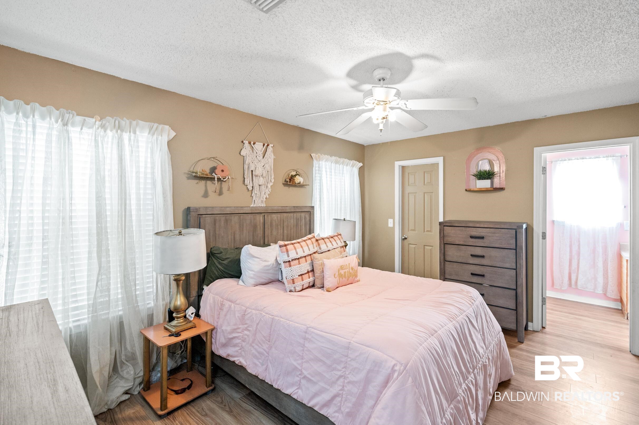 1603 Abbey Loop Foley, AL 36535 - Photo 18 of 35 Bedroom with ceiling fan, a textured ceiling, and light hardwood / wood-style flooring