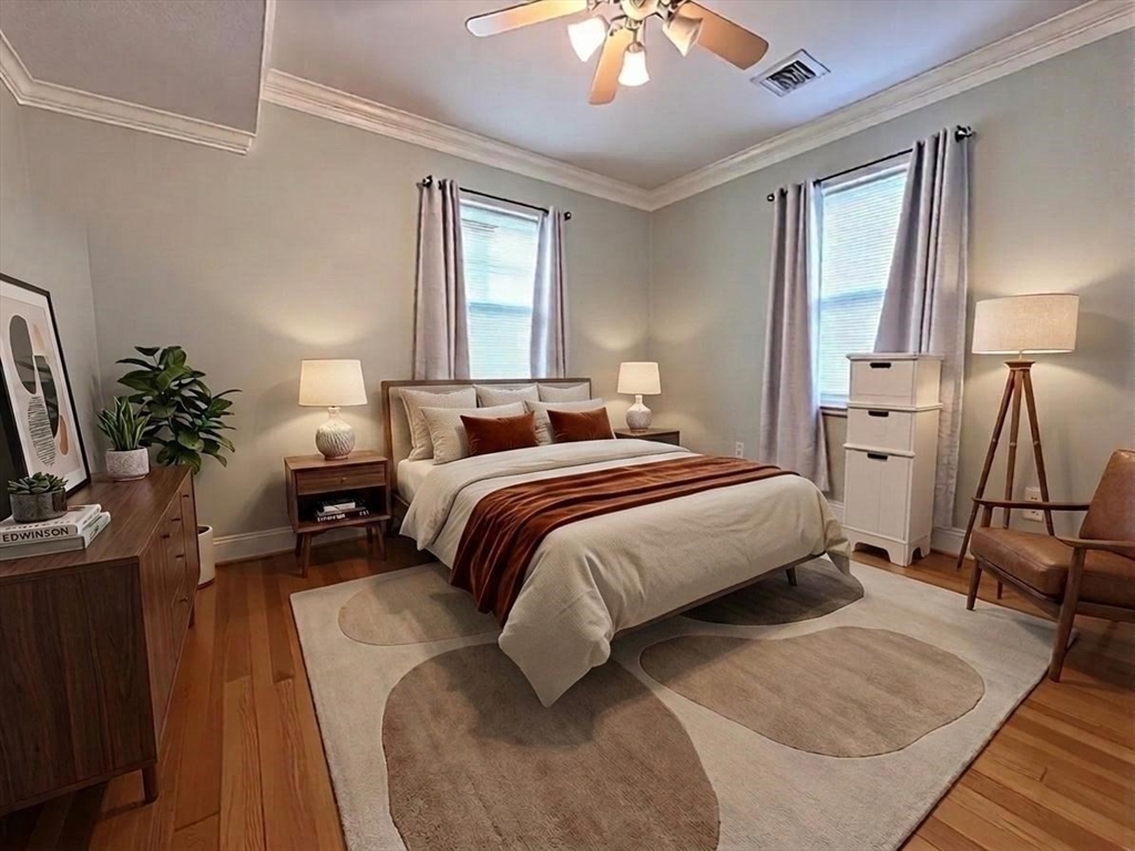 6 Wyman Street, Unit 3 Boston, MA 02130 - Photo 4 of 9 a bedroom with a bed a lamp and a large window