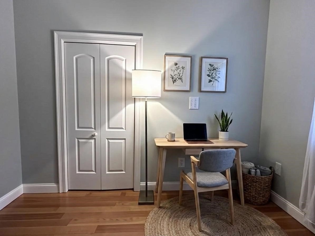 6 Wyman Street, Unit 3 Boston, MA 02130 - Photo 7 of 9 a workspace with furniture and wooden floor