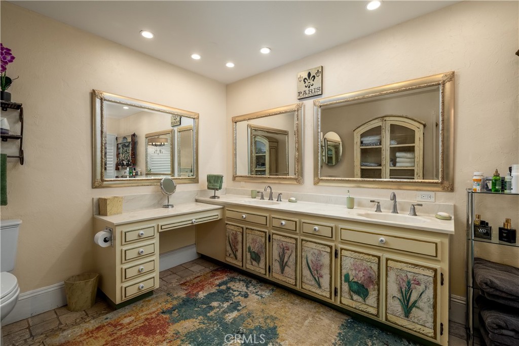 24105 Carancho Road Temecula, CA 92590 - Photo 22 of 49 Main house primary bath. 2 sinks and sit down make-up table