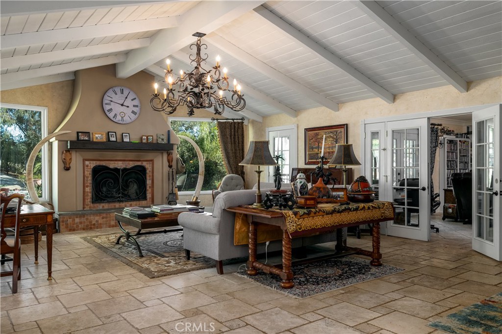 24105 Carancho Road Temecula, CA 92590 - Photo 8 of 49 Main house view from dining area into living room space with den to the right through french doors.