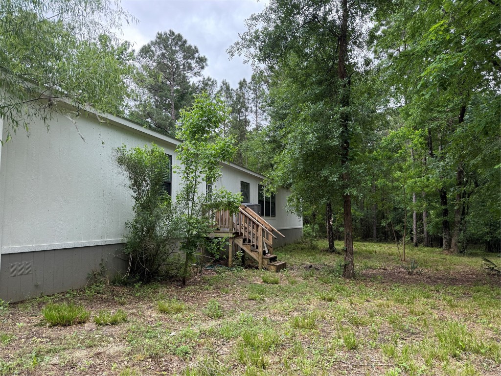 105 Saddle Surrey Road Coldspring, TX 77331 - Photo 44 of 46 101 - Back