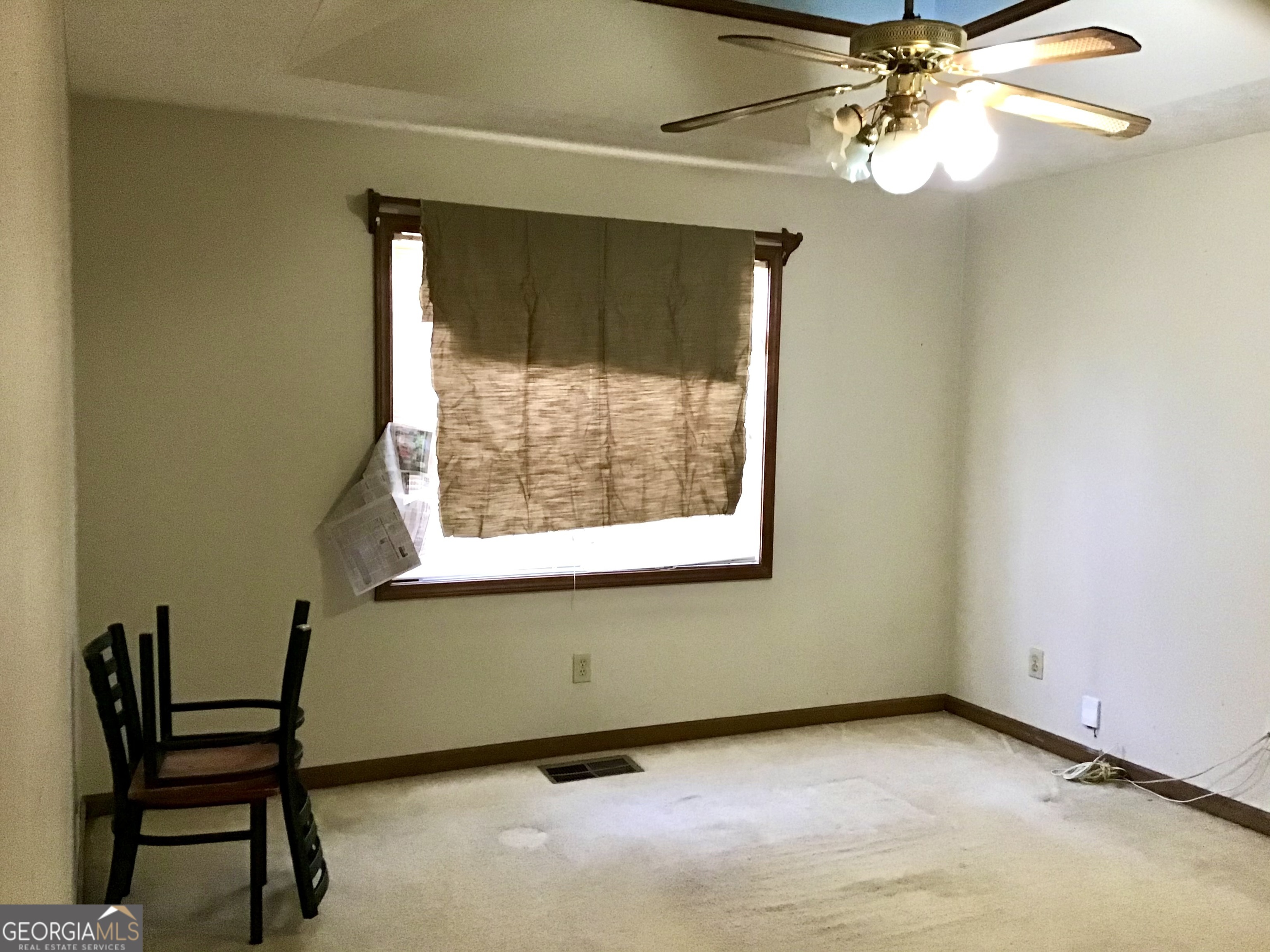 8363 Norris Lake Road Snellville, GA 30039 - Photo 12 of 28 a view of a workspace with furniture and a window