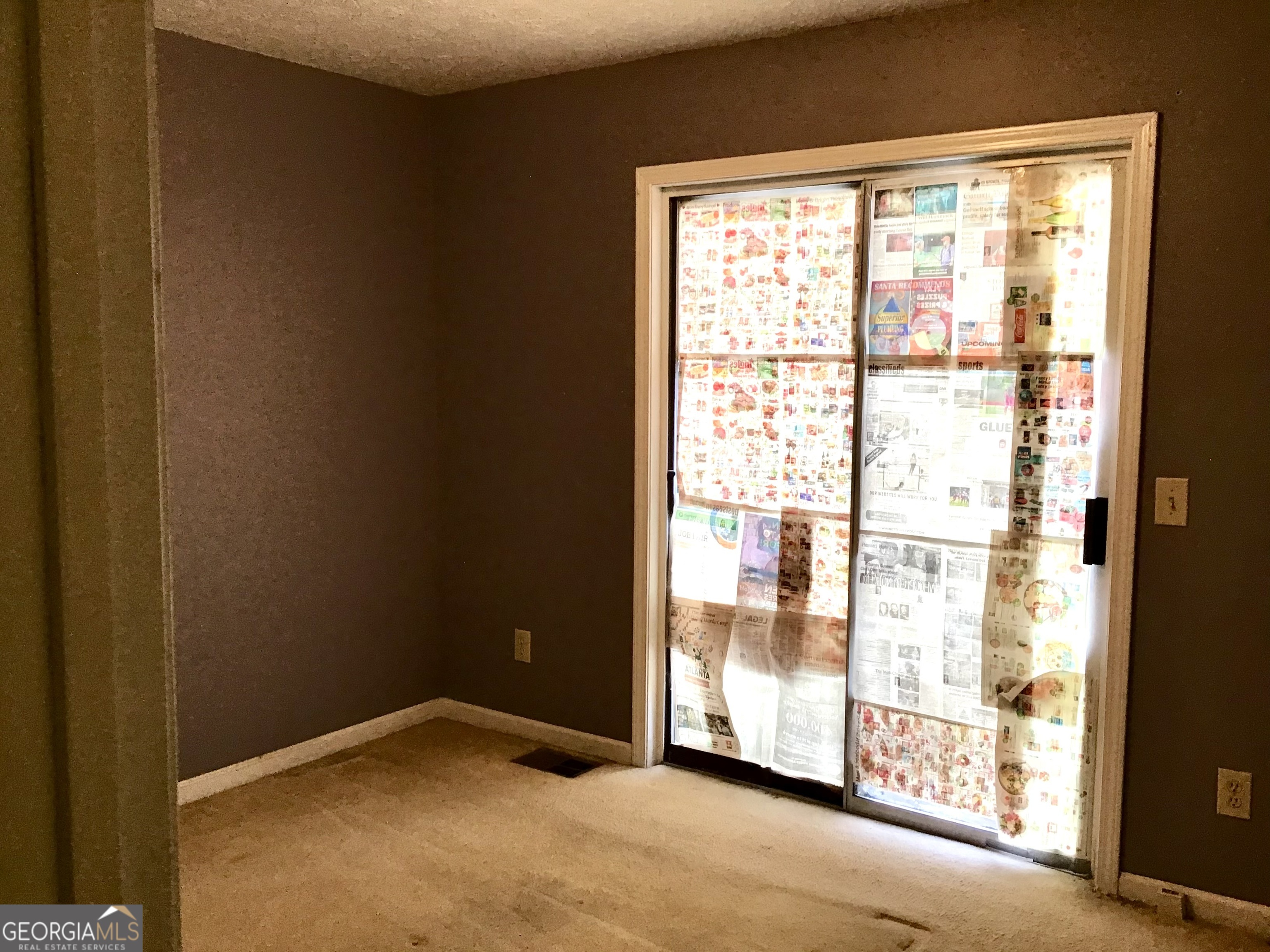 8363 Norris Lake Road Snellville, GA 30039 - Photo 19 of 28 a view of empty room with floor to ceiling window