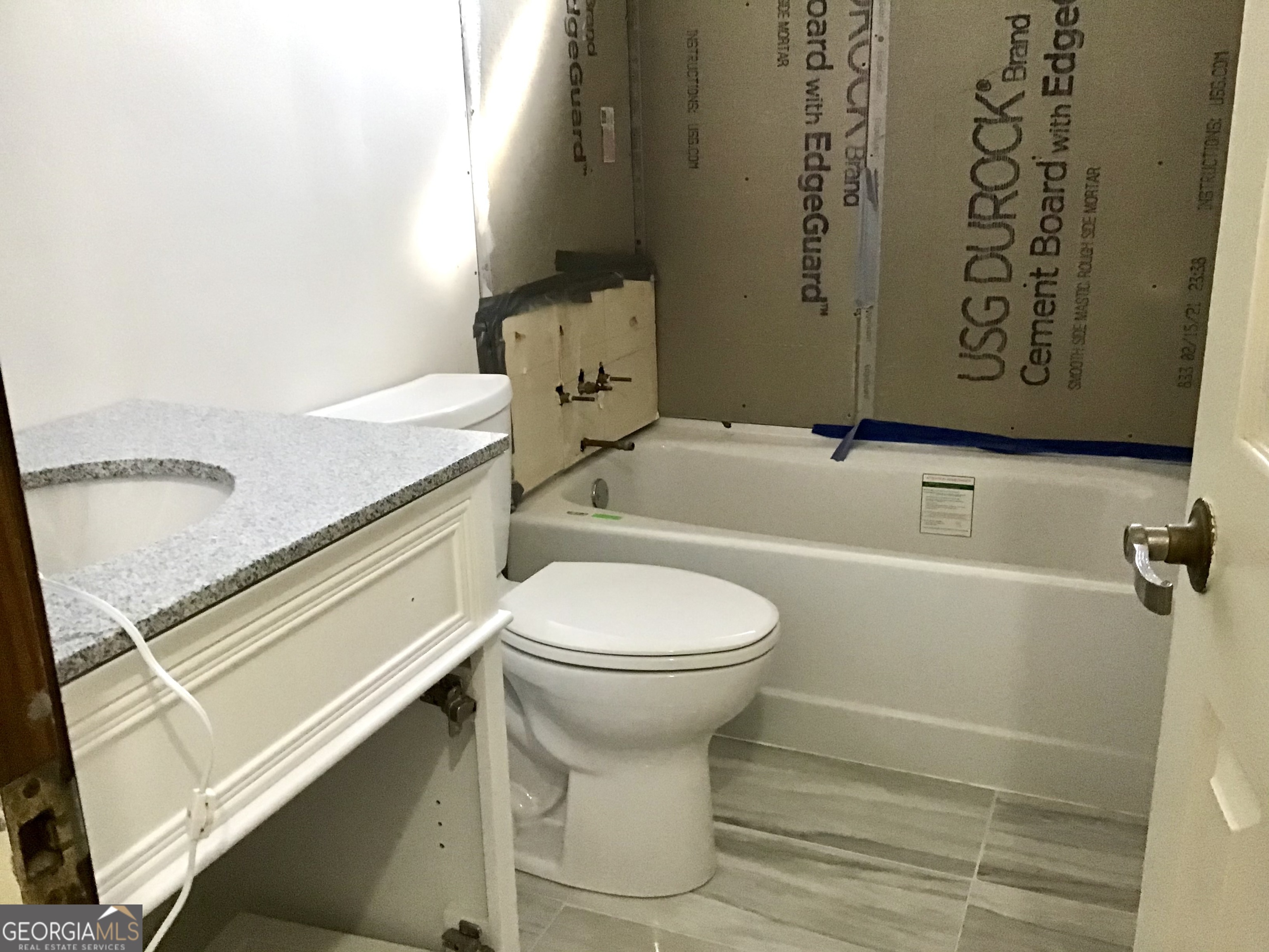 8363 Norris Lake Road Snellville, GA 30039 - Photo 22 of 28 a bathroom with a sink and toilet