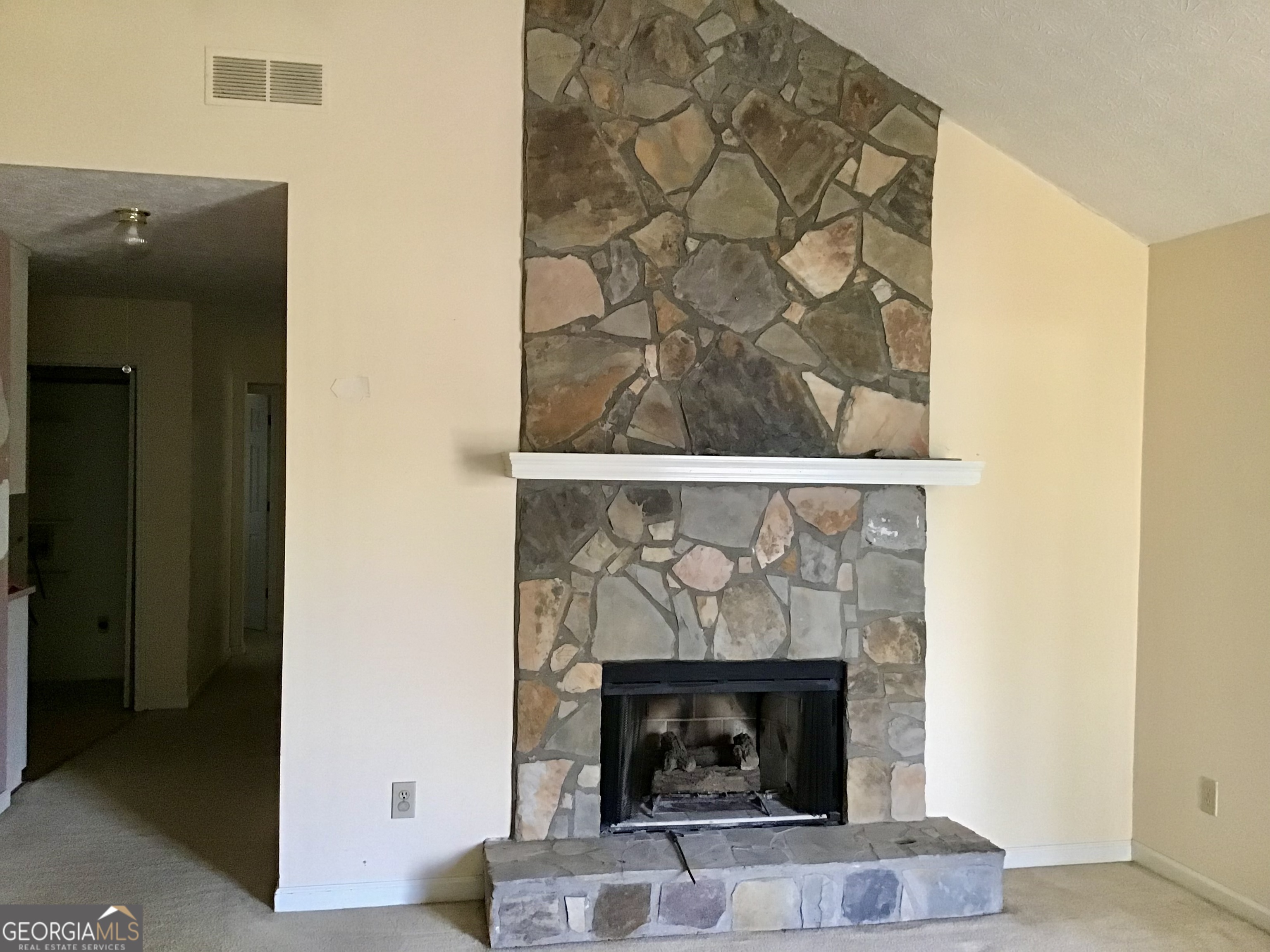 8363 Norris Lake Road Snellville, GA 30039 - Photo 4 of 28 a living room with a fireplace
