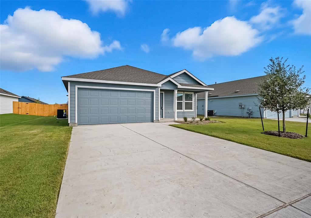 3707 Spring Run Drive Sherman, TX 75092 - Photo 18 of 18 a front view of a house with a yard and garage