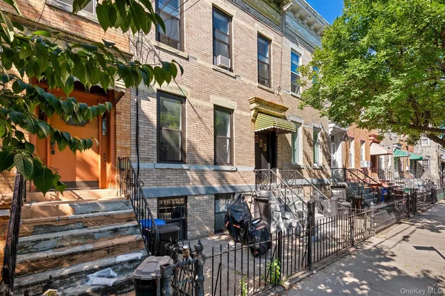 a view of front of house with large windows