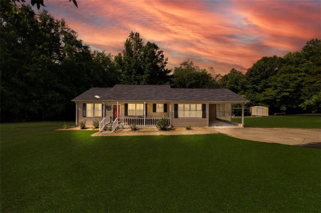 891 Silver Shoals Road Lula, GA 30554 - Photo 1 of 1 a front view of a house with a garden