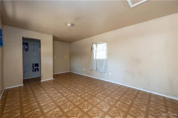 a view of an empty room and window