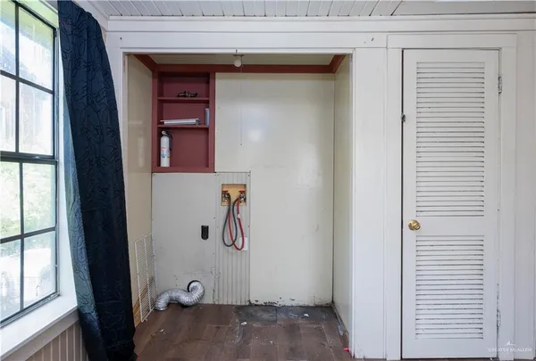 a view of a door and a window