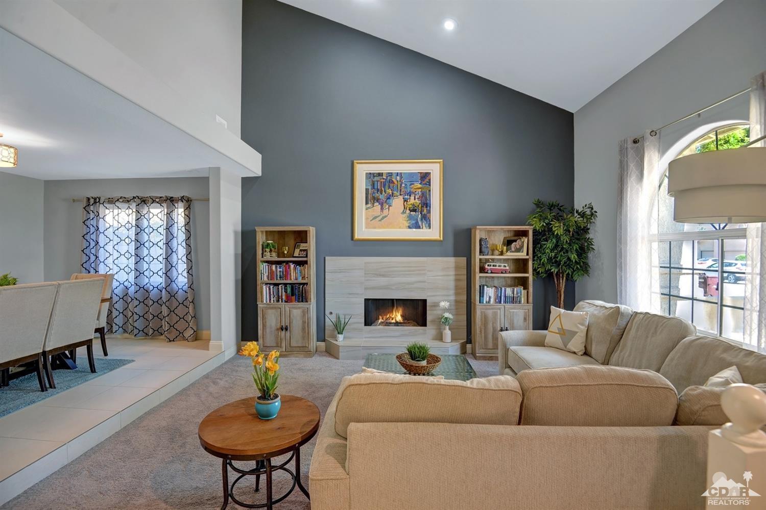 68710 Raposa Road Cathedral City, CA 92234 - Photo 2 of 29 a living room with fireplace furniture and a wooden floor