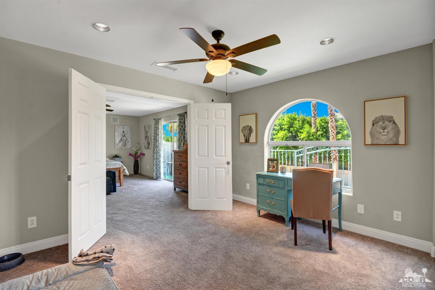 68710 Raposa Road Cathedral City, CA 92234 - Photo 19 of 29 a living room with furniture and a window