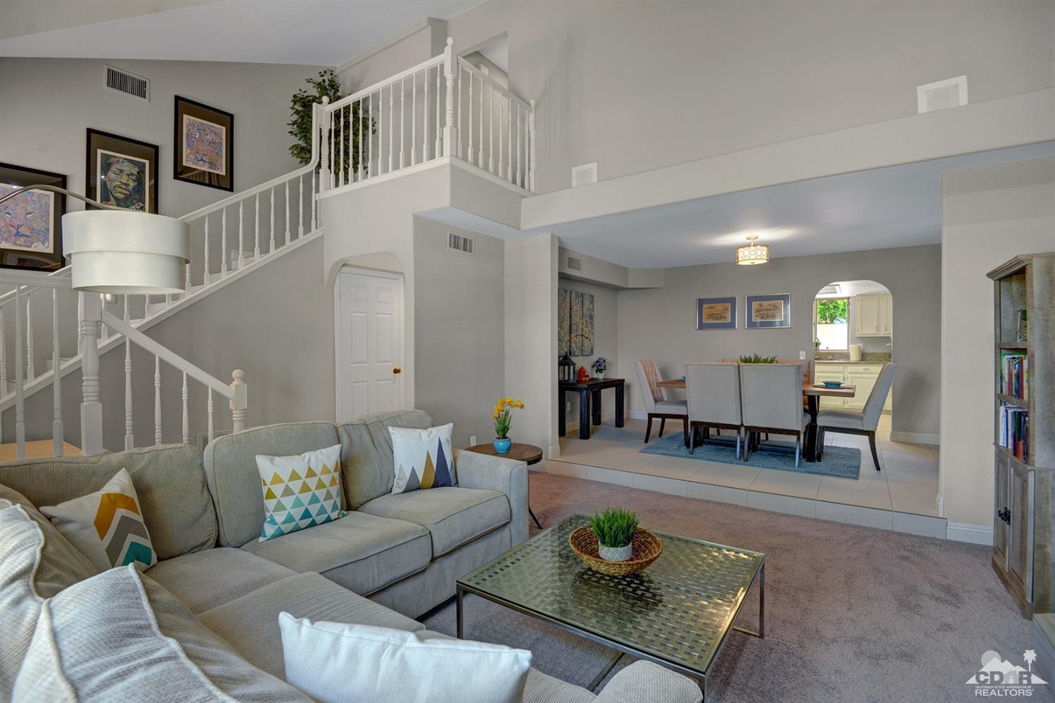 68710 Raposa Road Cathedral City, CA 92234 - Photo 3 of 29 a living room with furniture and wooden floor