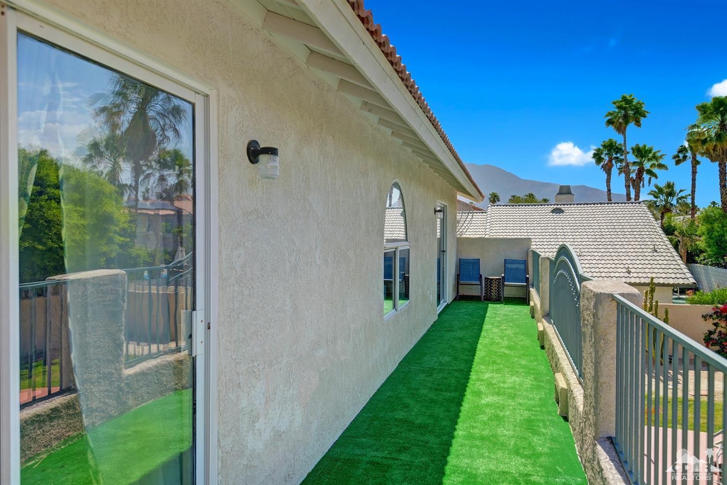 68710 Raposa Road Cathedral City, CA 92234 - Photo 22 of 29 a view of a house with backyard and garden