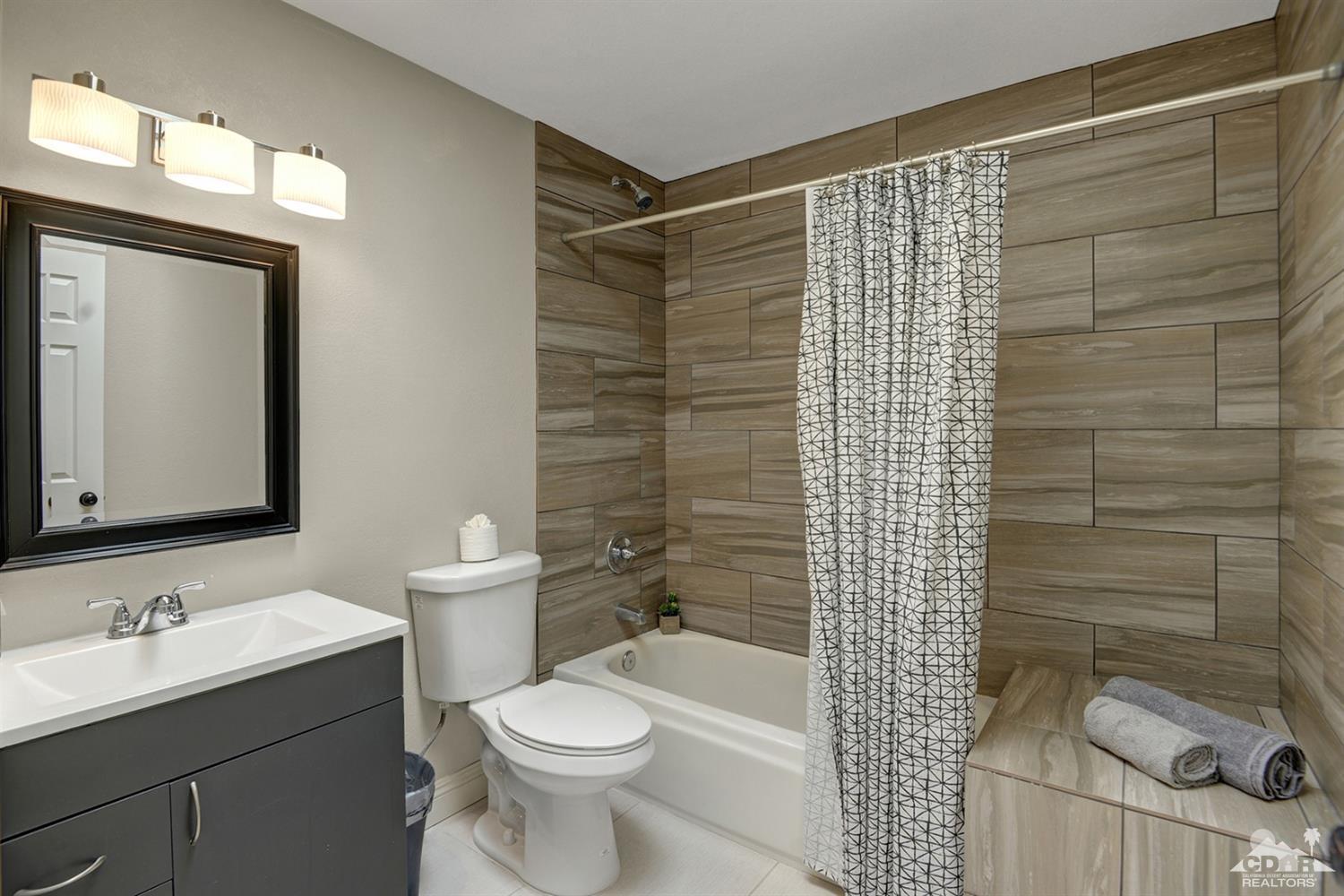 68710 Raposa Road Cathedral City, CA 92234 - Photo 24 of 29 a bathroom with a sink toilet and shower