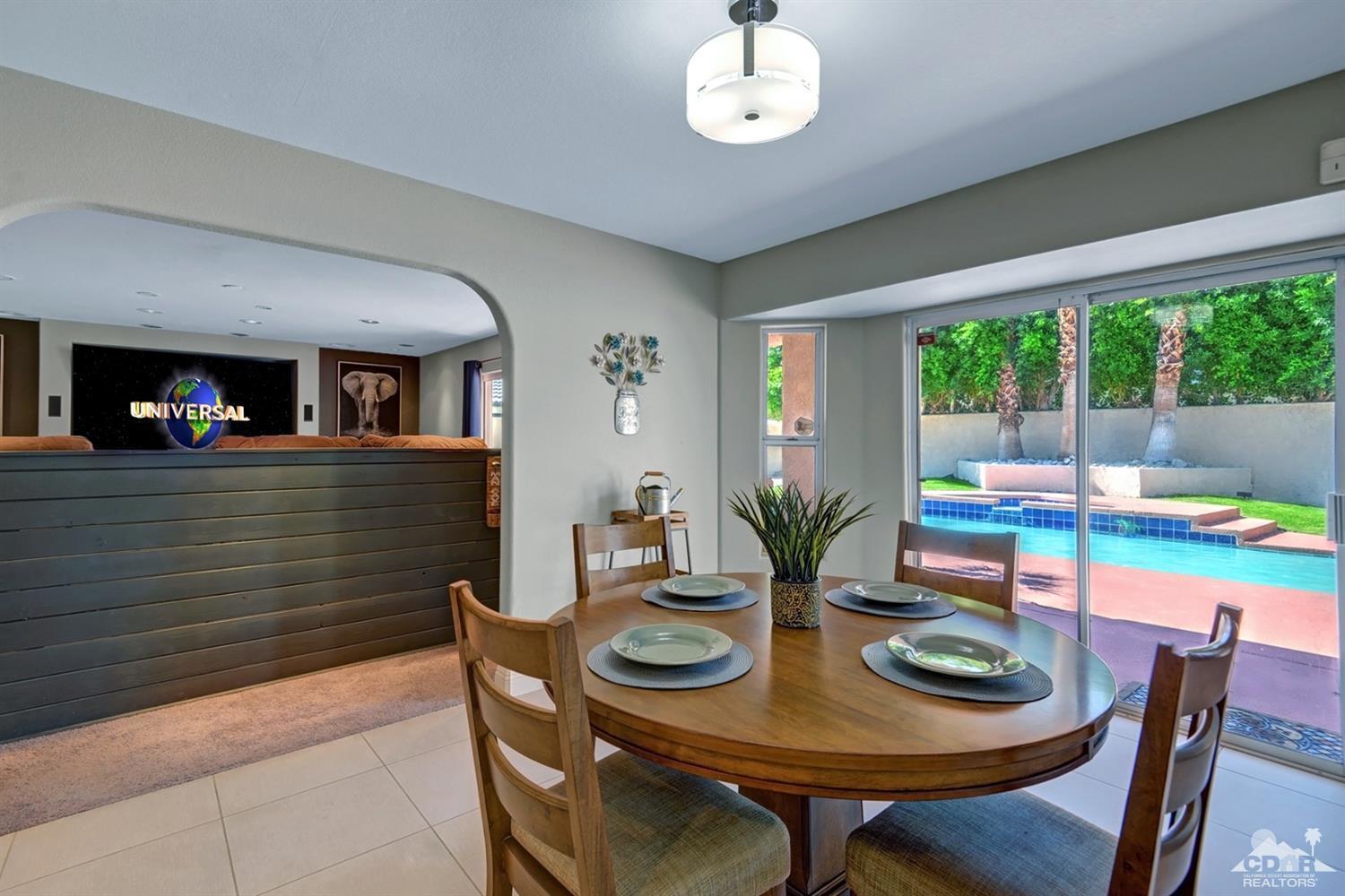 68710 Raposa Road Cathedral City, CA 92234 - Photo 7 of 29 a view of a dining room with furniture window and outside view