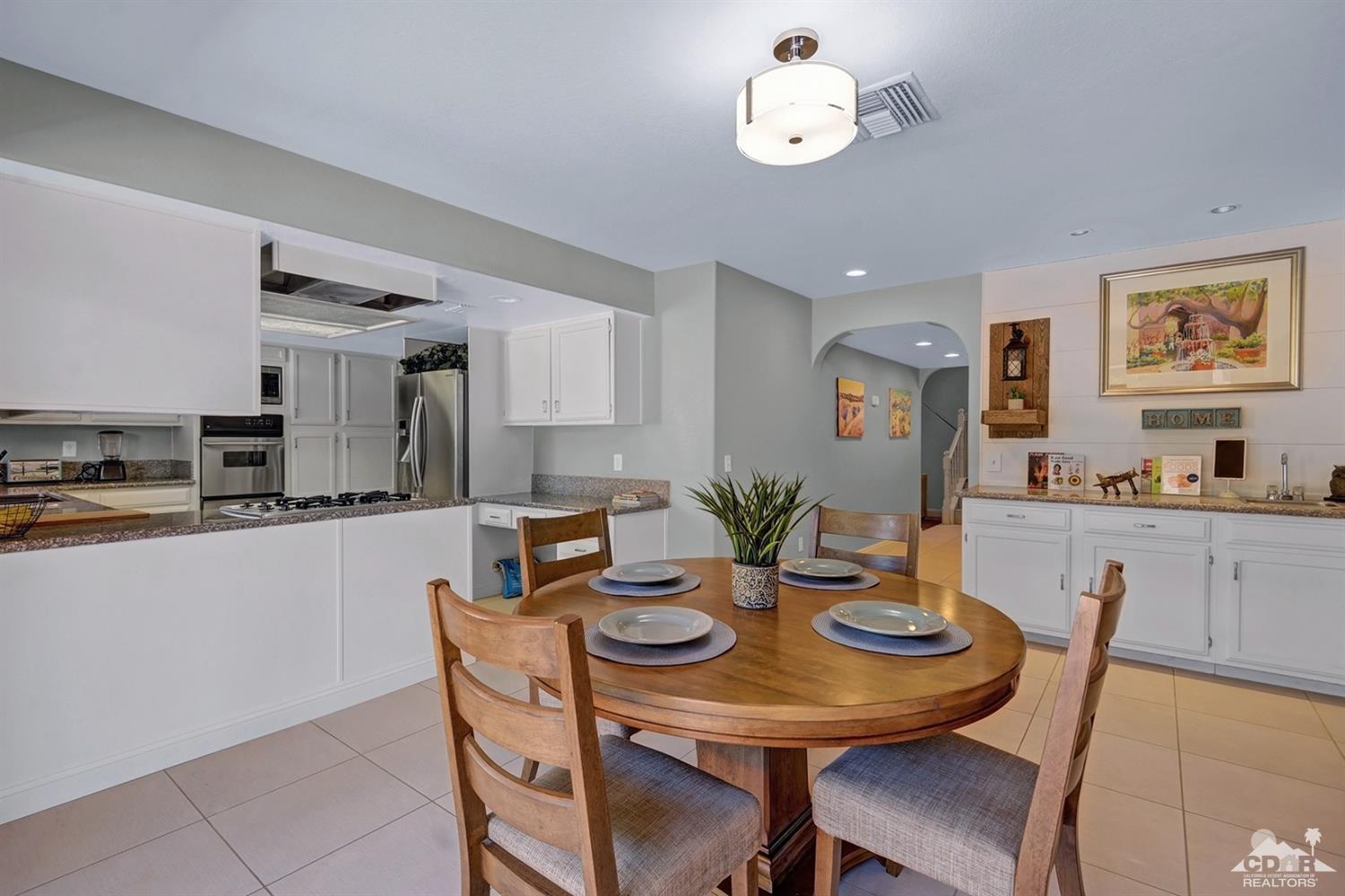68710 Raposa Road Cathedral City, CA 92234 - Photo 10 of 29 a view of a dining room with furniture
