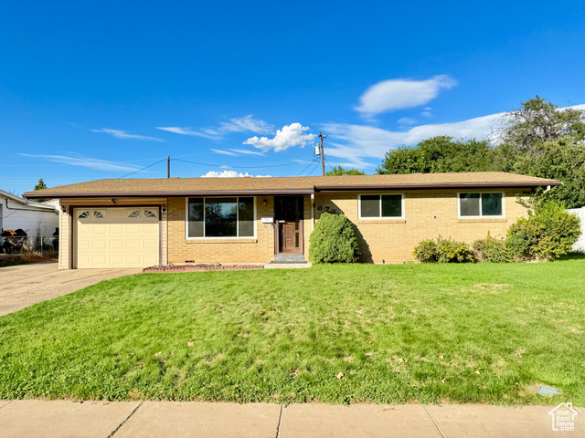 Undisclosed Address Layton, UT 84041 - Photo 1 of 1 Ranch-style house with a front lawn, an attached garage, brick siding, driveway, and a shingled roof