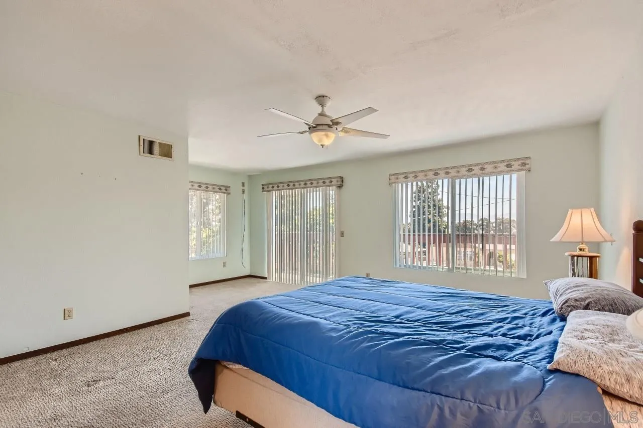 396 El Monte Road El Cajon, CA 92020 - Photo 11 of 18 a bedroom with a large bed and a window