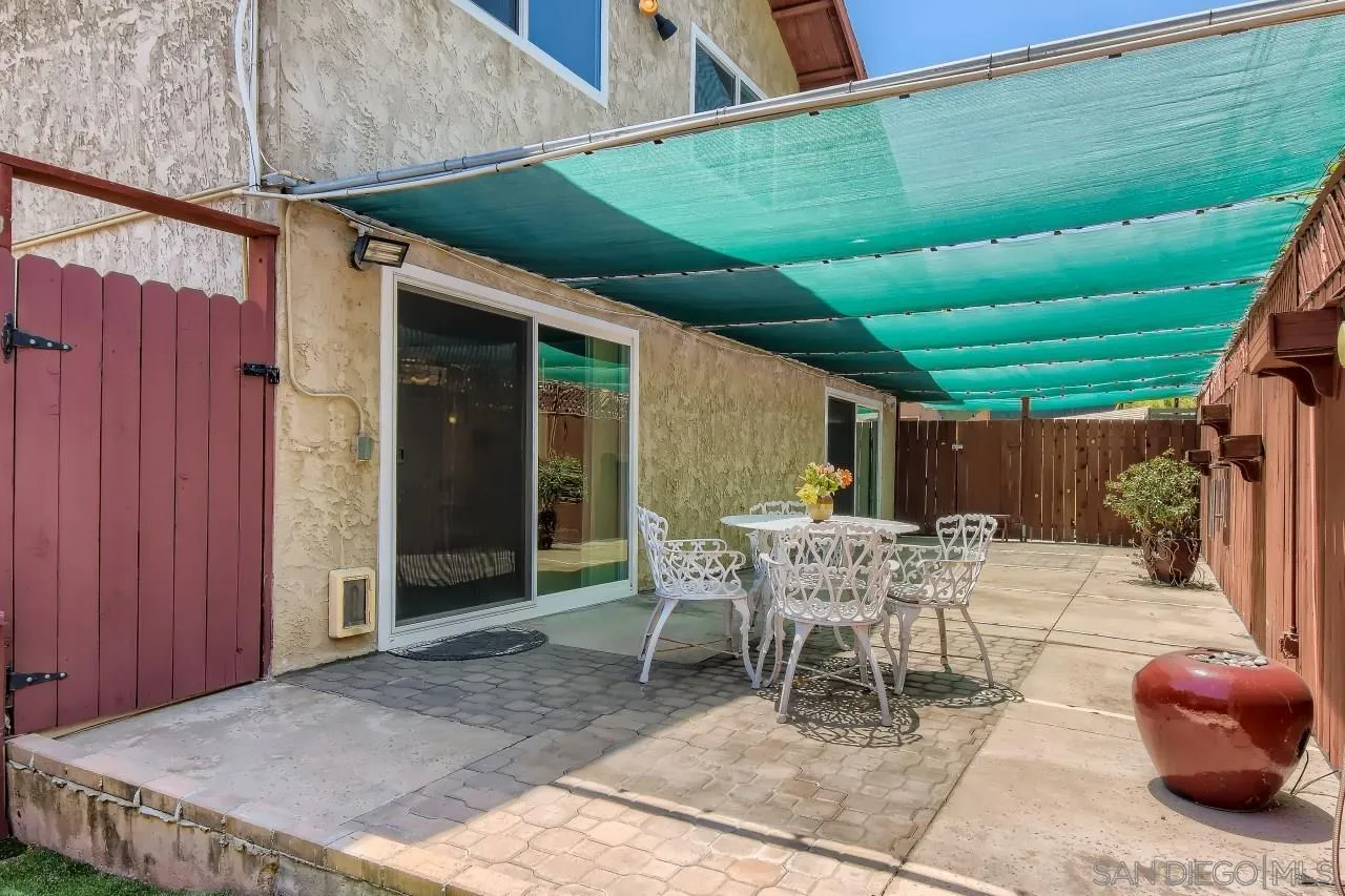 396 El Monte Road El Cajon, CA 92020 - Photo 18 of 18 a patio with a table and chairs