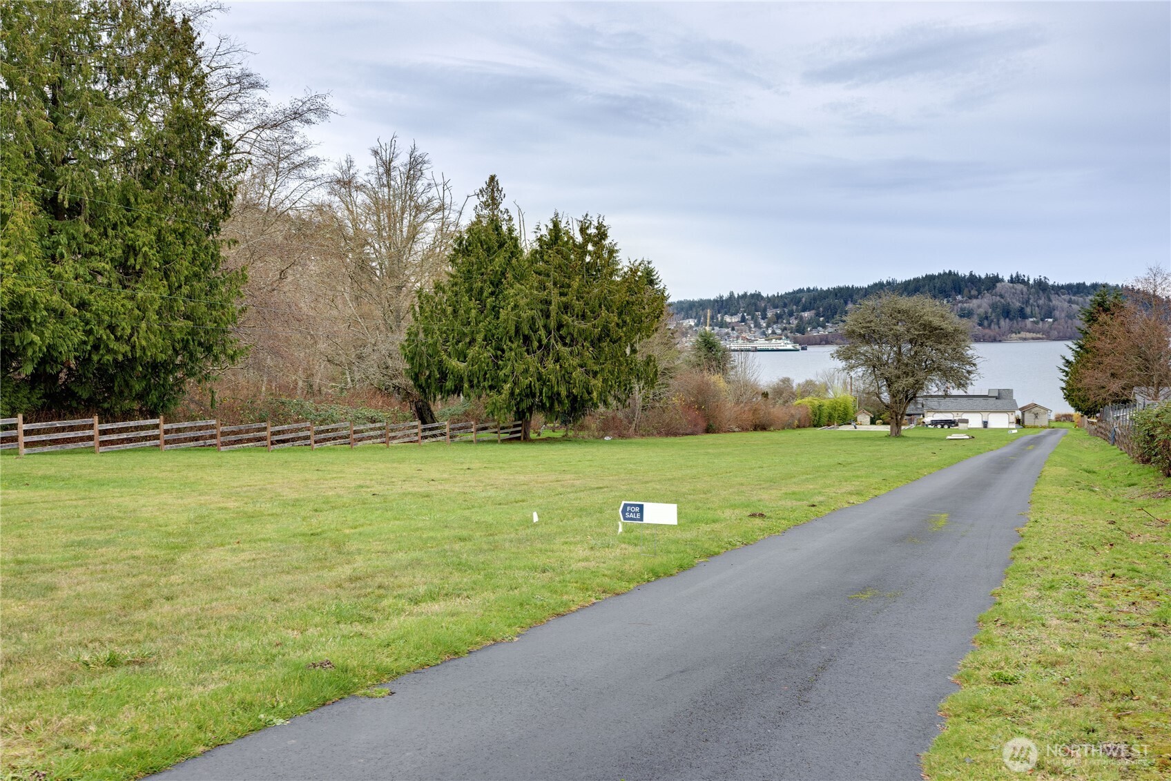 0 Northeast Jefferson Point Road Kingston, WA 98346 - Photo 16 of 21 a view of a lake with a big yard