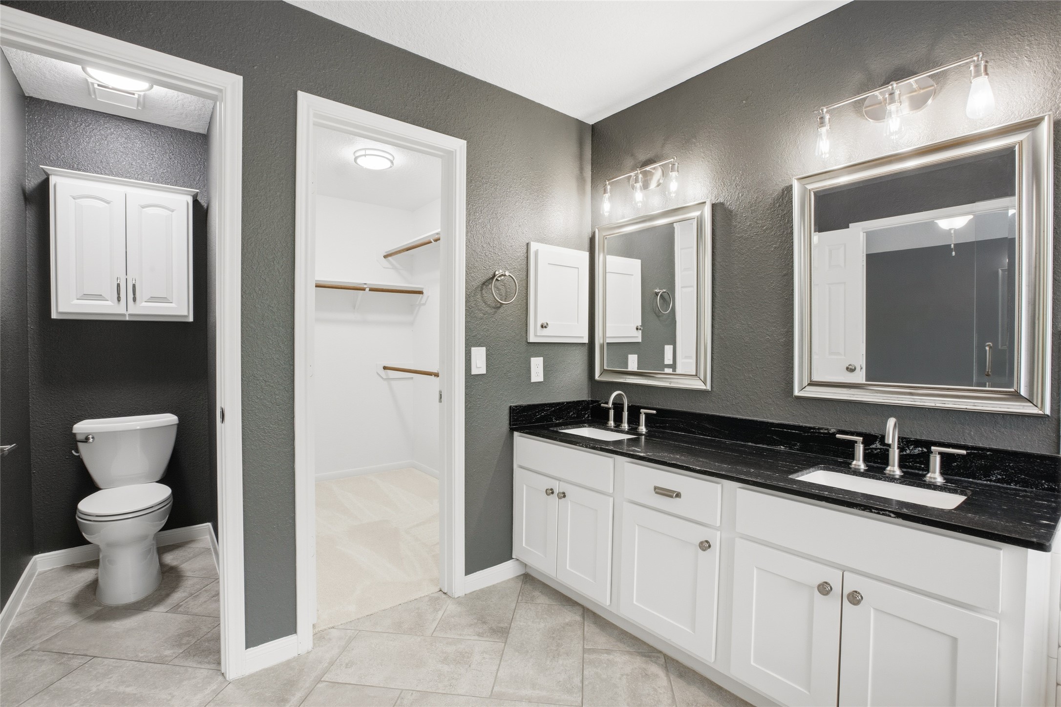 20907 Nettlebrook Lane Katy, TX 77450 - Photo 25 of 46 The ensuite bath feels like your own private retreat with brushed nicket fixtures, custom mirrors and a huge walk in closet. Every element works together to create a space that feels luxurious.