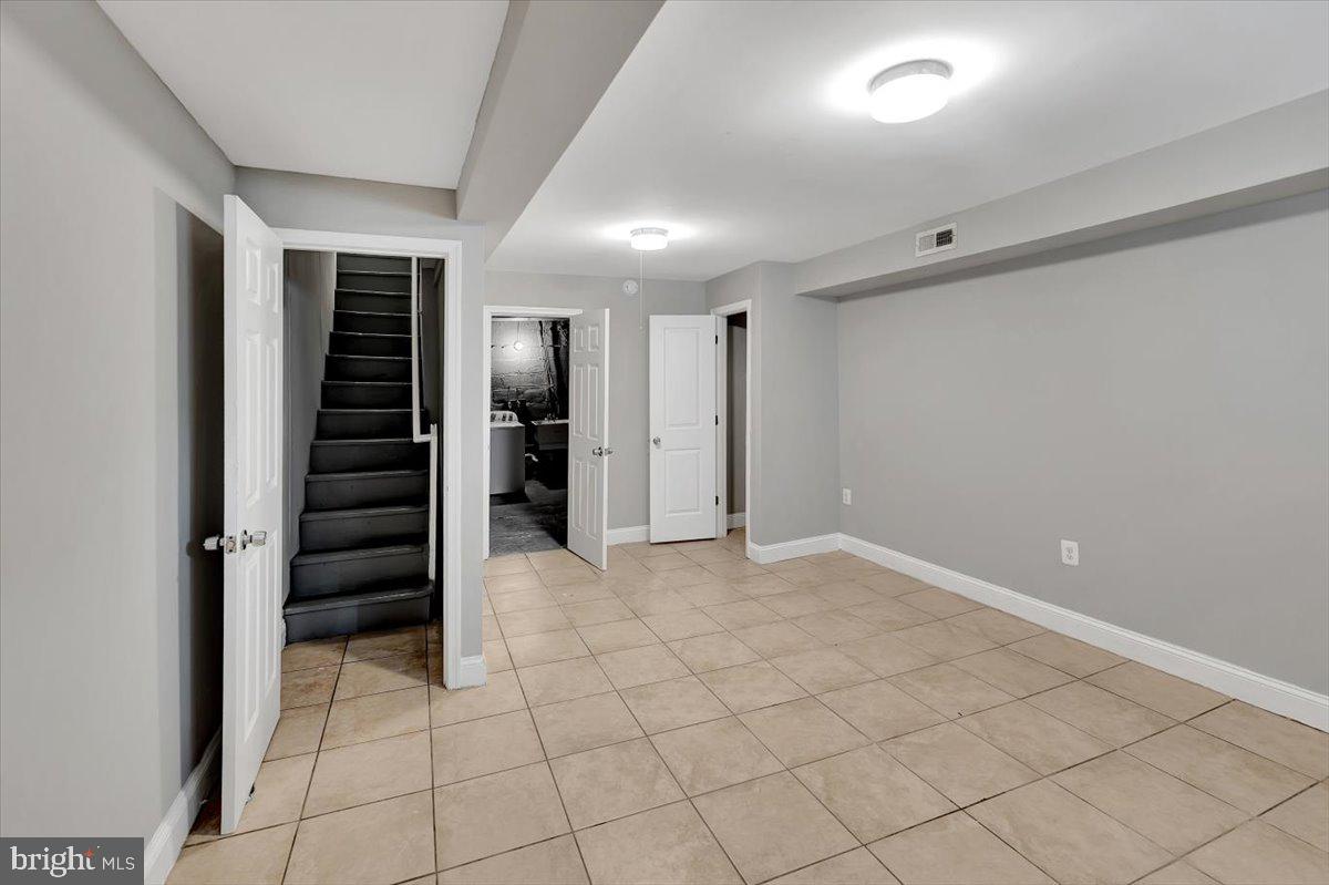 74 South Kossuth Street Baltimore, MD 21229 - Photo 15 of 18 a view of an empty room with a window