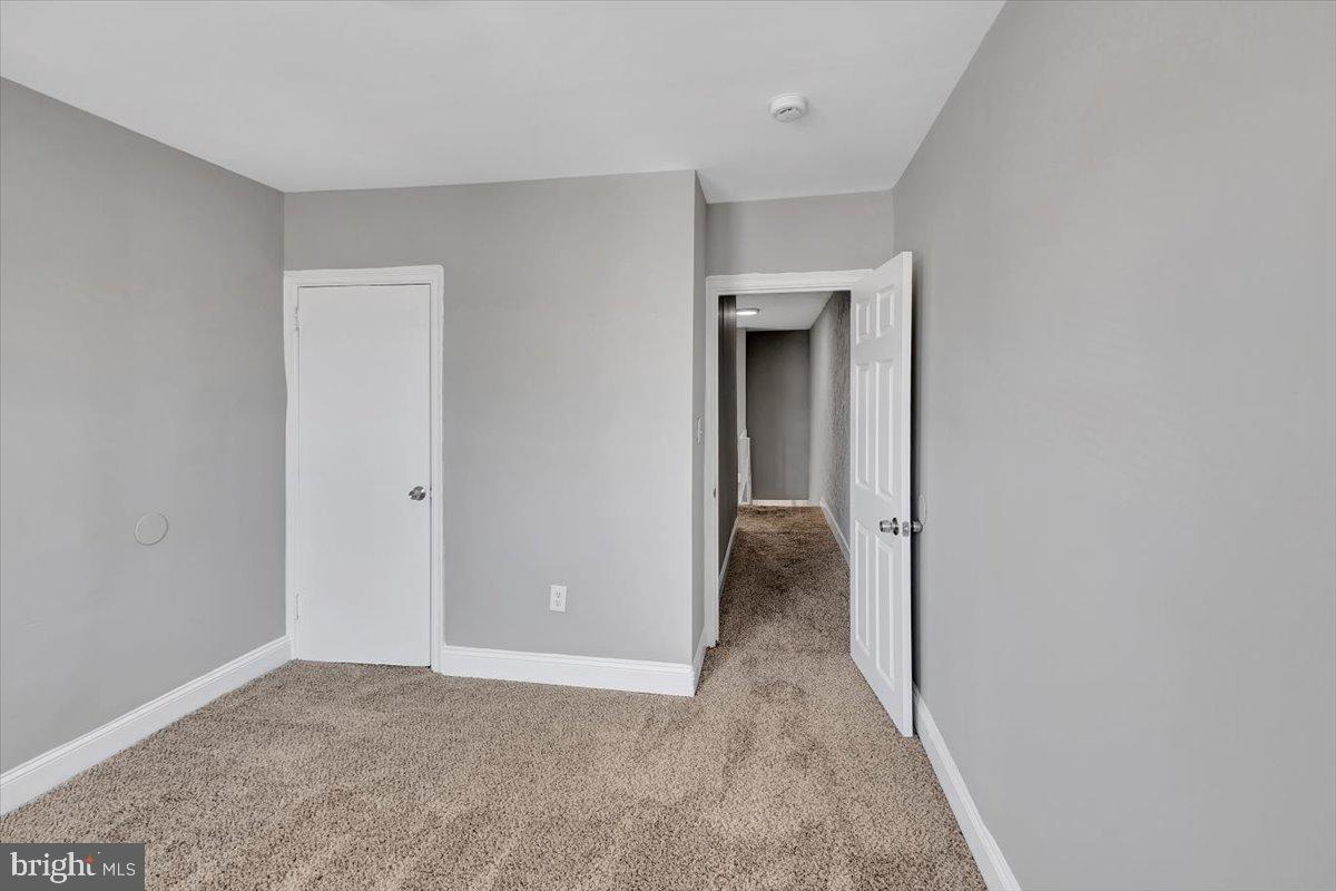 74 South Kossuth Street Baltimore, MD 21229 - Photo 3 of 18 a view of a room with a hallway