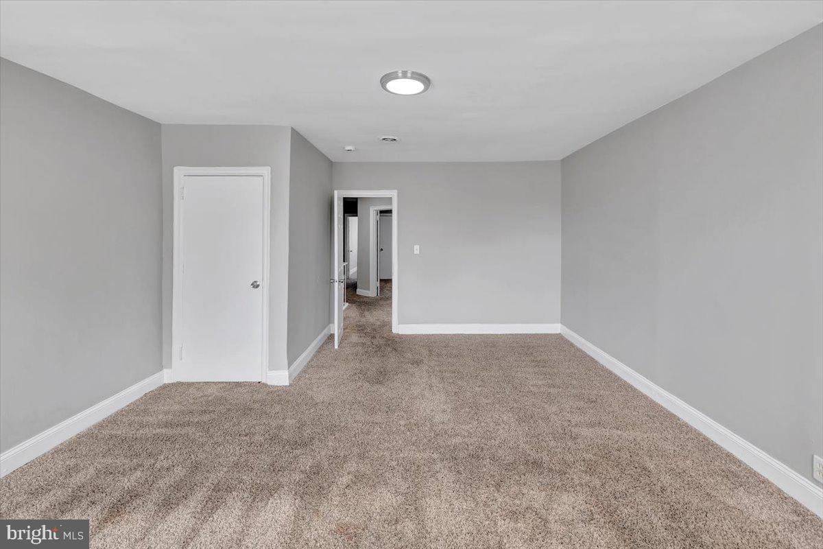 74 South Kossuth Street Baltimore, MD 21229 - Photo 7 of 18 a view of an empty room