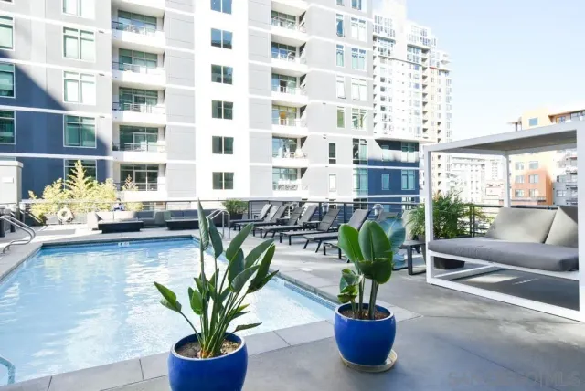 a view of a flower pot with a table and chair