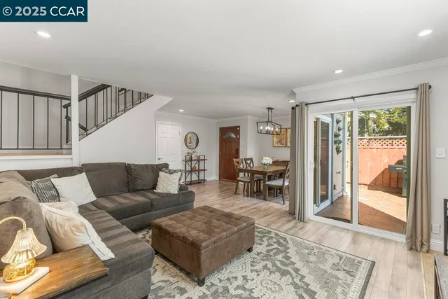 a living room with a fireplace and a flat screen tv
