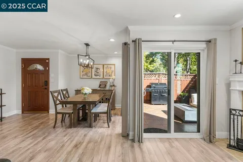a kitchen with stainless steel appliances granite countertop a refrigerator sink and stove