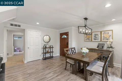 a bathroom with a granite countertop sink a mirror and shower