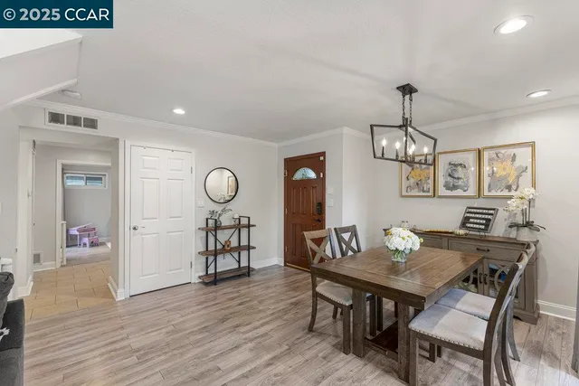 a bathroom with a granite countertop sink a mirror and shower
