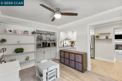 a view of a kitchen with a refrigerator and a sink
