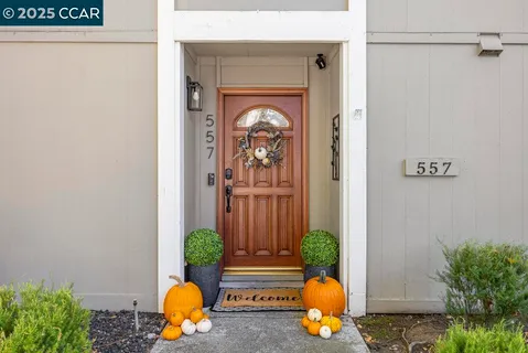 a front view of a house with a tub and glass door