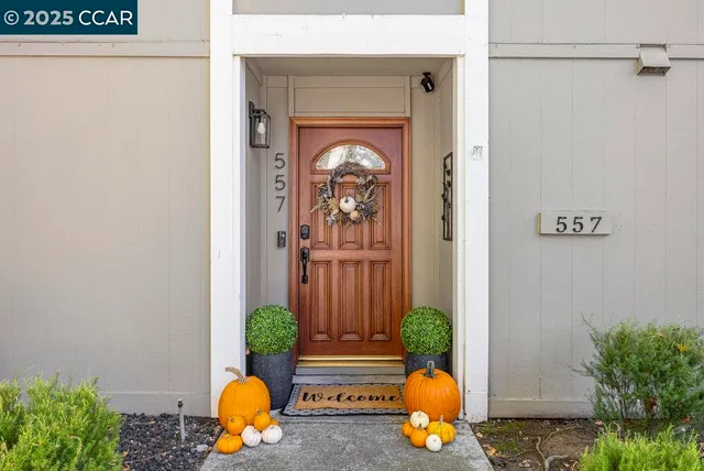 a front view of a house with a tub and glass door