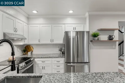 a bedroom with a large bed and a flat screen tv
