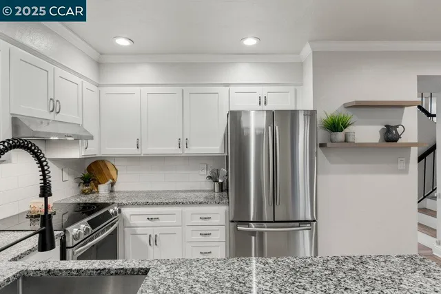 a bedroom with a large bed and a flat screen tv